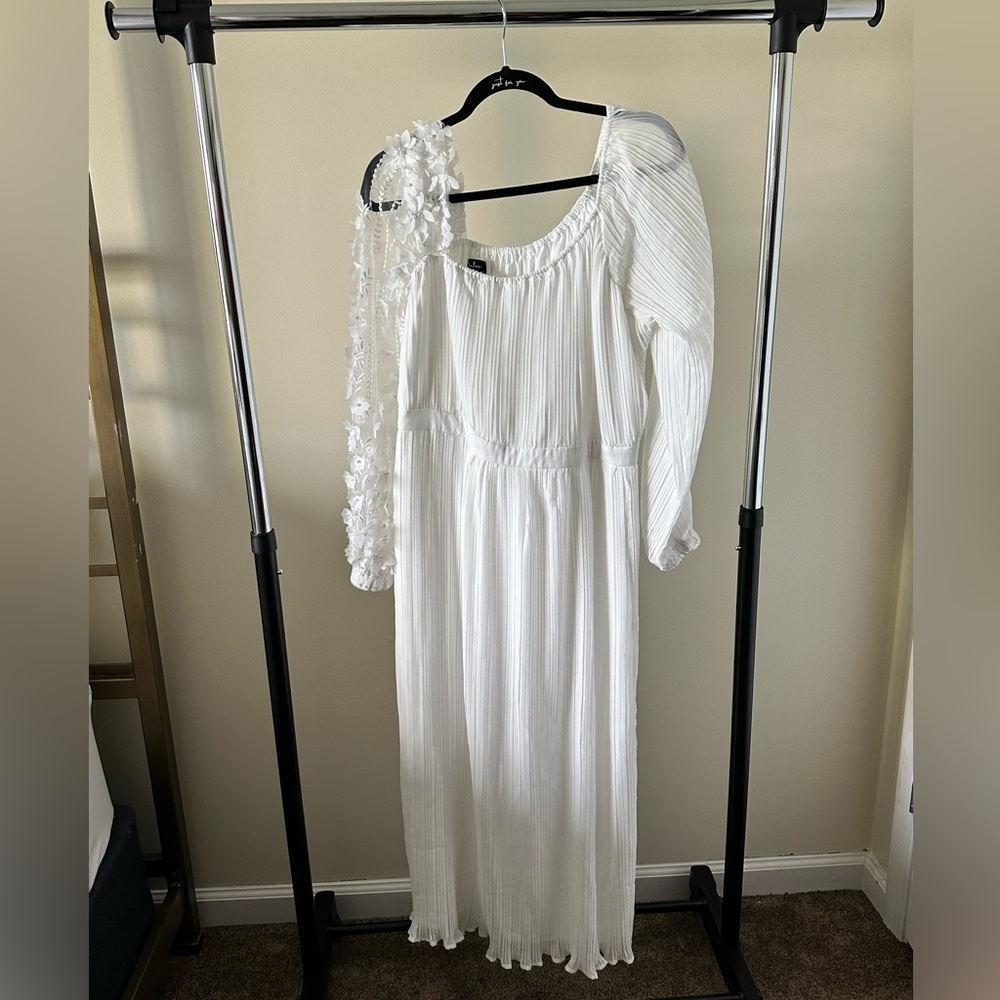 customized white midi dress with statement long sleeves.